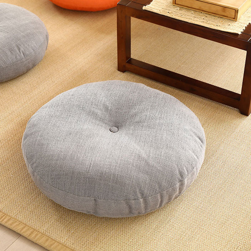 Lotus Linen Meditation Cushion – Gray pad on woven mat with dark wood table