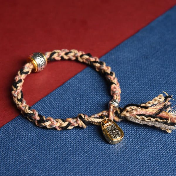 Zakiram Goddess Bracelet – Pink and black braided cord with gold-framed pendant, bohemian woven bracelet