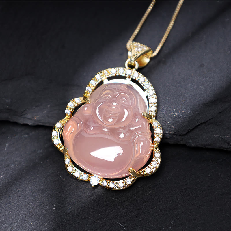 Jade Laughing Buddha Luck Necklace – pink Buddha on black slate with gold crystal frame, closeup, soothing warmth