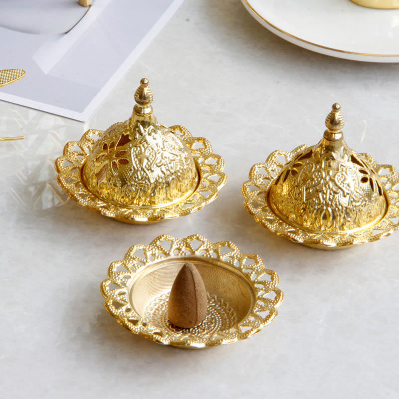 Tibetan Gold Mini Meditation Incense Burner – Three gold burners on marble, one open with cone, pierced dome lids Hauptbild