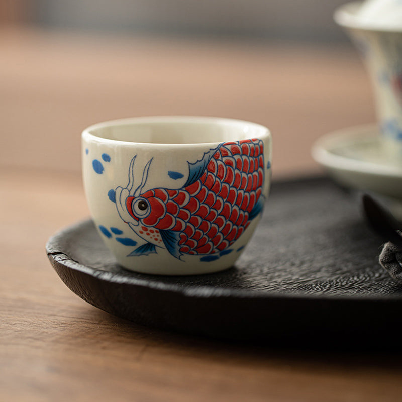 Koi Peony Sunflower Cup – close-up of koi fish and arowana artwork, Chinese tea