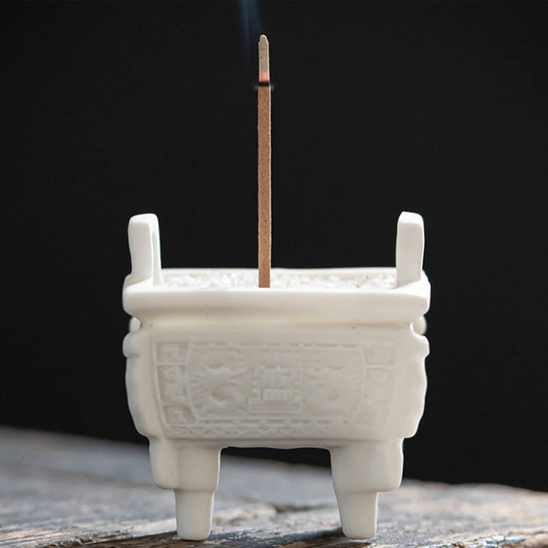 Dragon Ceramic Incense Burner – fangding censer with lit incense on weathered wood, black backdrop, zen