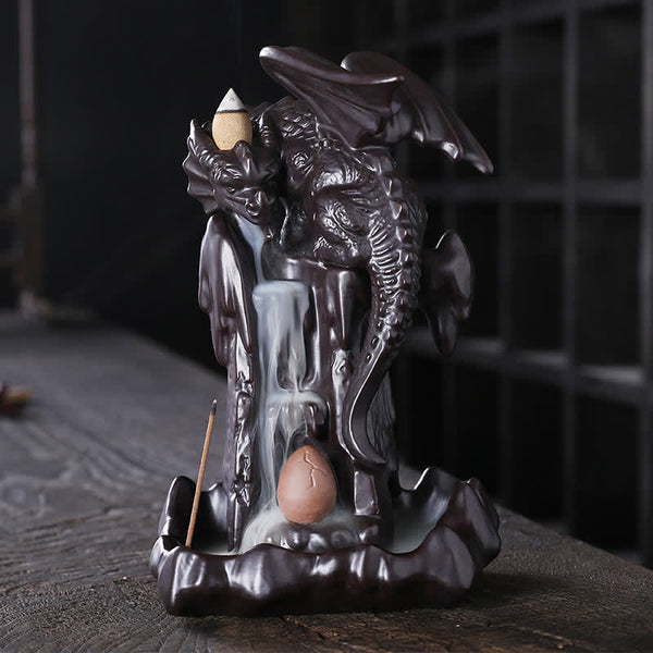 Nordic Dragon Backflow Incense Burner with dragon egg detail, smoke waterfall on dark wood, ceramic dragon sculpture