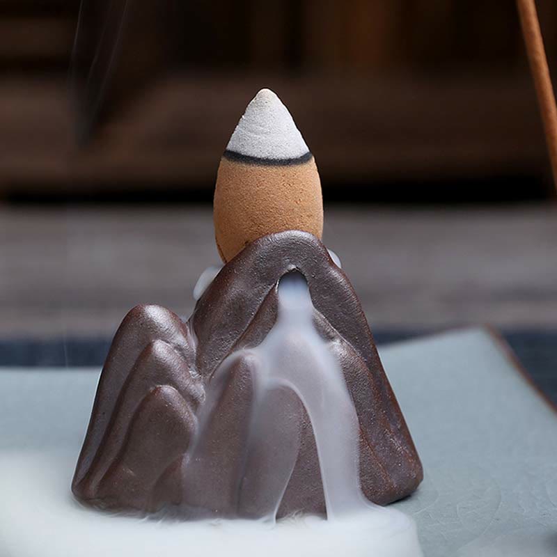 Lotus Ceramic Backflow Incense Burner - close-up mountain peak with active backflow smoke waterfall effect