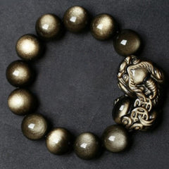 Golden Obsidian Bracelet – Lifestyle wrist wear shot, golden sheen beads, wealth protection jewelry