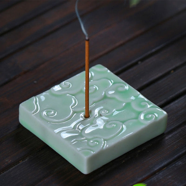 Mini Auspicious Clouds Ceramic Incense Burner – green square burner with smoke on dark wood slat, celadon ceramic incense holder