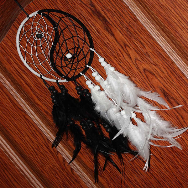 Yin Yang Dream Catcher with Feathers – Dual hoop dreamcatcher on warm wood floor, home decor