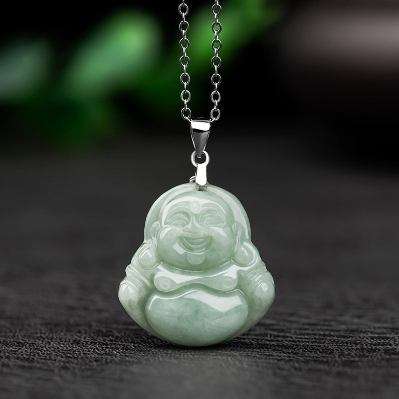 Jade Laughing Buddha Blessing Necklace – celadon jade pendant with silver chain on dark fabric, green bokeh, prosperity