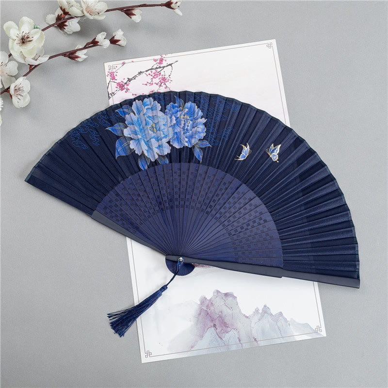 Peony Folding Fan – Navy blue fan with blue peonies and butterflies in gold accents, folding fan