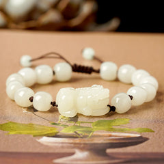 Hetian White Jade PiXiu Bracelet – White jade barrel beads with carved PiXiu on artistic paper