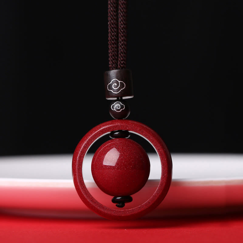 Cinnabar PiXiu Necklace – Red cord cloud-bead pendant against dark background, dramatic lighting, blessing bead