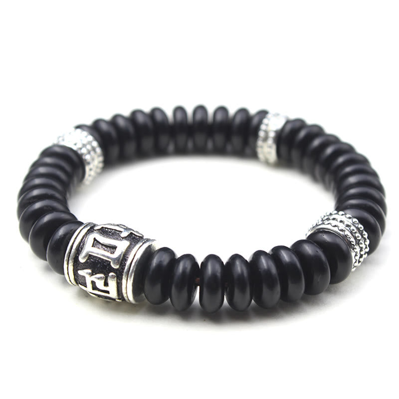 Om Mani Padme Hum Coconut Shell Bracelet – three-quarter angle on white, silver charm bracelet