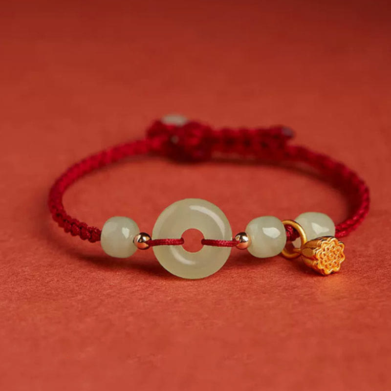 Jade Peace Buckle Lotus Bracelet – pale celadon jade bi disc with gold lotus charm on red woven cord, Protection