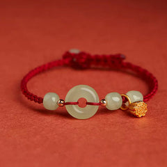 Jade Peace Buckle Lotus Bracelet – pale celadon jade bi disc with gold lotus charm on red woven cord, Protection