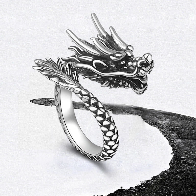 Sterling Silver Dragon Ring - elevated angle on white with ink wash, dragon eyes and fangs, lucky