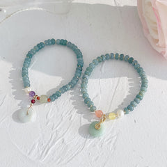 Hetian Jade Pearl Fu Gourd Money Bag Bracelet – Two jade bracelets with Fu charm and jade disc on white, fortune bracelet