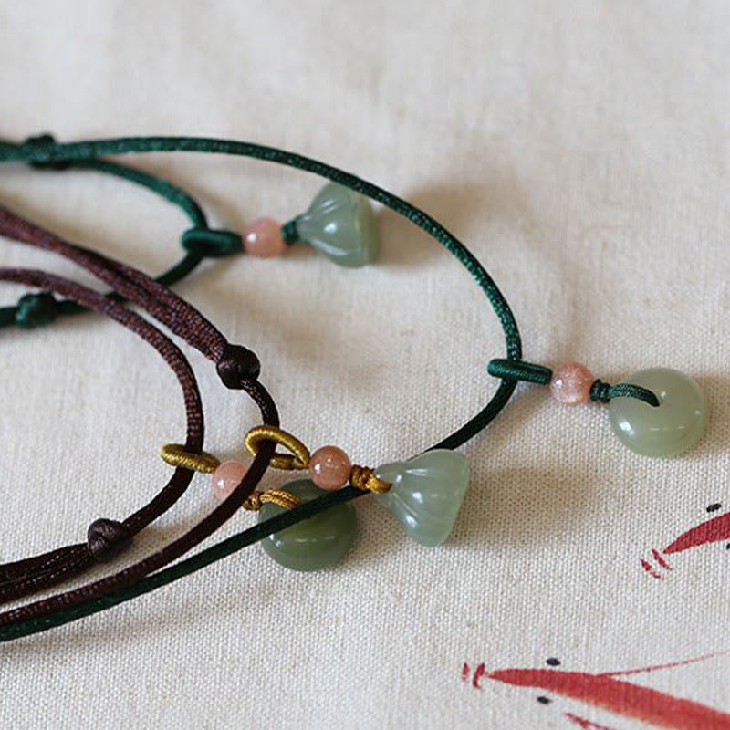 Jade Peace Buckle Lotus Necklace – Two adjustable cord necklaces with lotus and bi-disc jade on linen fabric, jade necklace