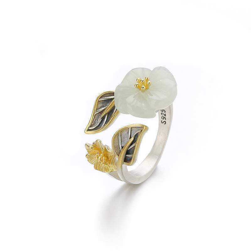 White Jade Plum Blossom Silver Ring - Open floral ring on white background with S925 hallmark, carved jade flower, gold flower bud, and detailed silver leaf work