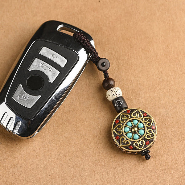 Tibetan Bodhi Seed Peace Key Chain – Turquoise floral medallion with gold scrollwork, two views, handmade pendant