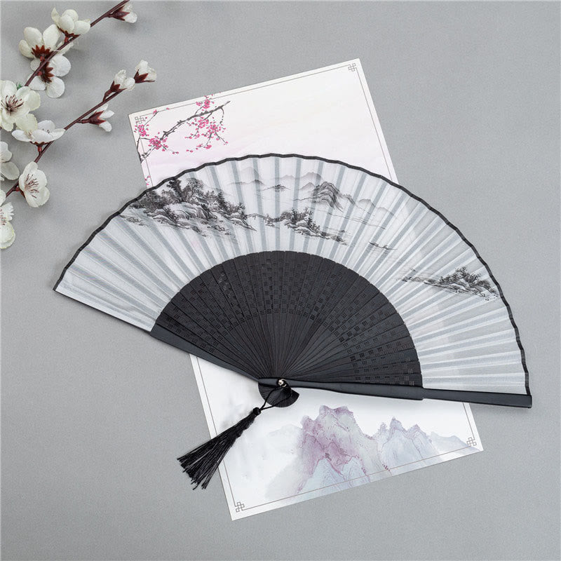 Mountain Landscape Fan – Black folding fan with ink wash mountains, pagoda, and boat, bamboo hand fan