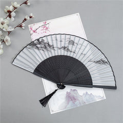 Mountain Landscape Fan – Black folding fan with ink wash mountains, pagoda, and boat, bamboo hand fan