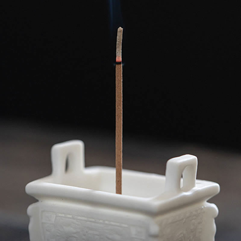 Dragon Ceramic Incense Burner – ding vessel on dark wood with natural light, embossed patterns, tranquil