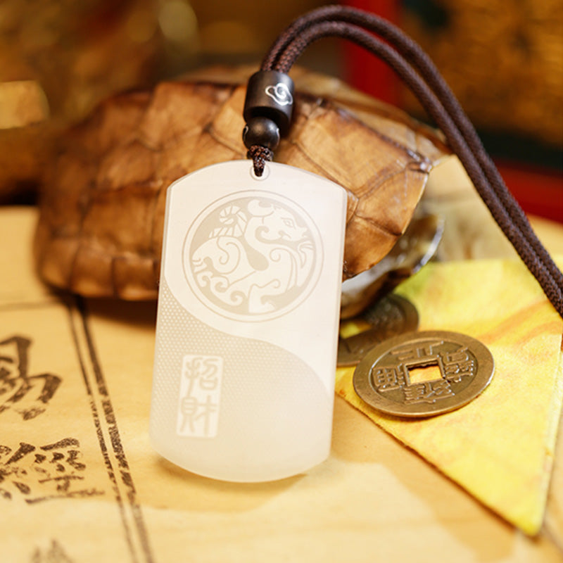 White Jade PiXiu Pendant – White jade PiXiu pendant with tortoise shell and Chinese coins on warm golden background