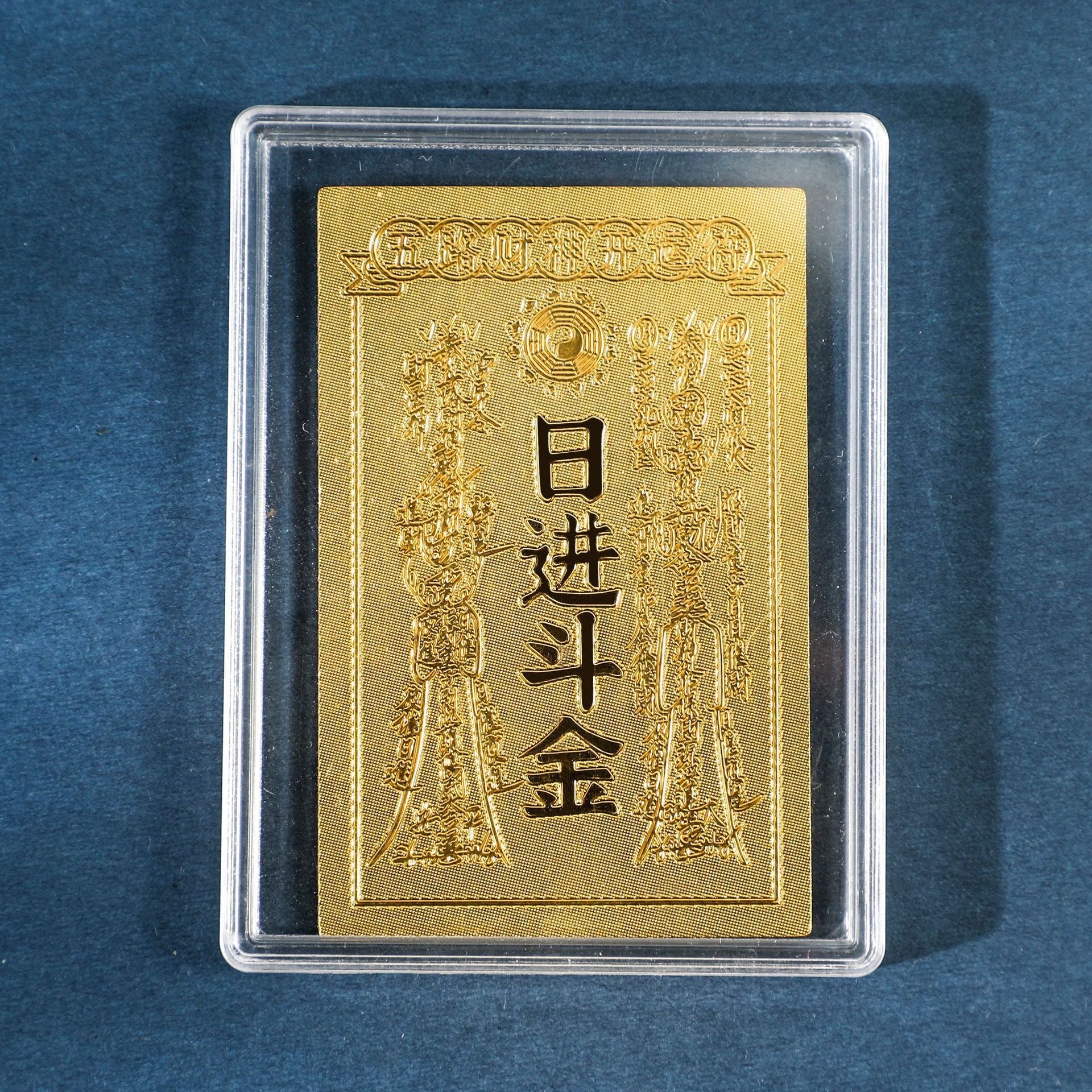 Gold Daily Gold Income sticker in clear display case on blue background