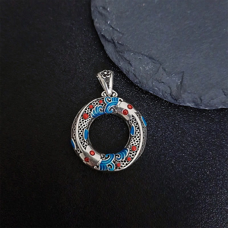 Koi Fish Peace Buckle Pendant - displayed on dark background, warm copper tones, zen