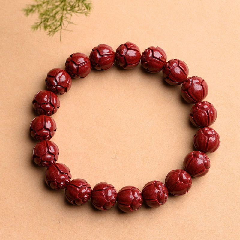 Cinnabar Om Mani Padme Hum Bracelet – lotus carved crimson beads with foliage accent, red stone bracelet