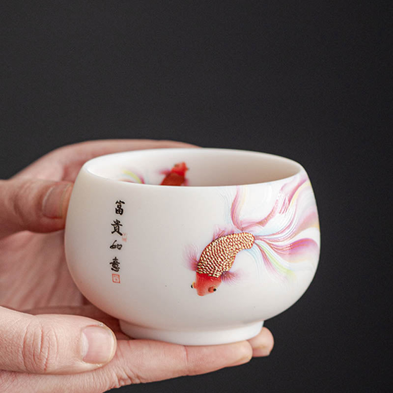 Koi Fish White Porcelain Cup - side angle displaying hand-painted koi and waves, tea ware