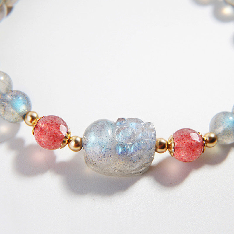 Moonstone PiXiu Bracelet – Extreme close-up of carved moonstone PiXiu with pink quartz, detail