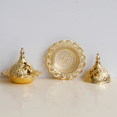 Tibetan Gold Mini Meditation Incense Burner – Gold burner separated into lid and base on white surface, floral cut-outs