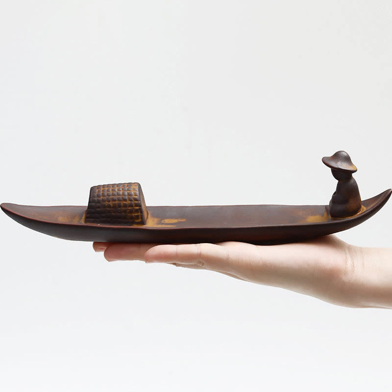 Fisherman Ceramic Incense Burner – Palm-held boat with seated figure on white, zen art decor