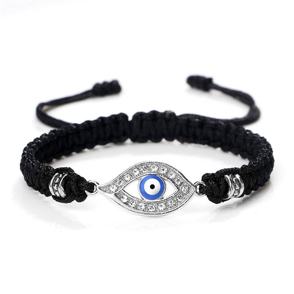 Black cord evil eye bracelet with silver blue evil eye crystal charm on white bg