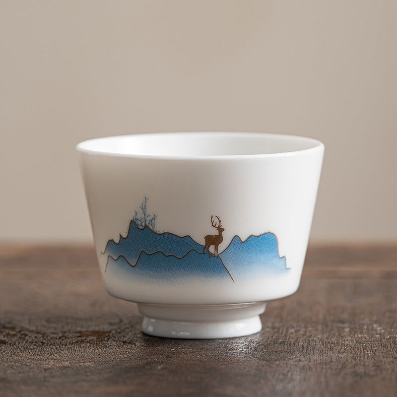 Ceramic Kung Fu Tea Cup – pink peony in blue ruyi cloud medallion on dark wood, scrollwork accents, colorful