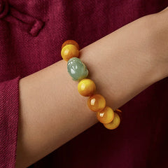 Zodiac Tiger Eye Jade Bracelet – Worn on wrist with maroon sleeve protection jewelry