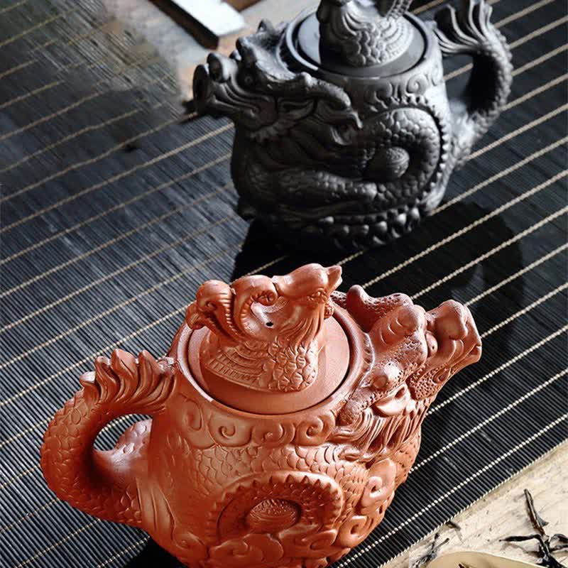 Vintage Dragon Phoenix Purple Clay Teapot – terracotta and black dragon teapot variants on striped bamboo mat, artisan craft