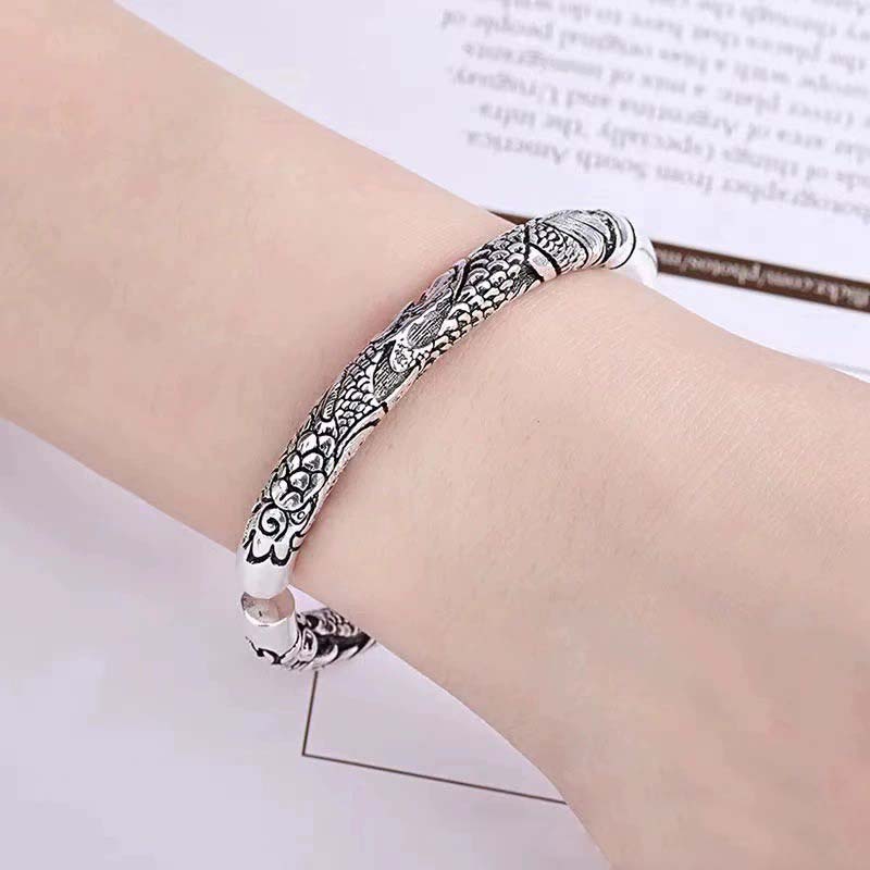Dragon Auspicious Clouds Bangle – wrist-worn carved cuff detailed view, Artisan Silver