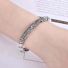 Dragon Auspicious Clouds Bangle – wrist-worn carved cuff detailed view, Artisan Silver
