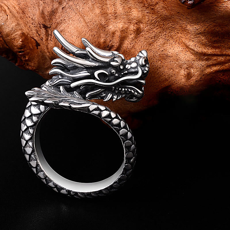 Sterling Silver Dragon Ring - side view on burl wood, dragon mane and clawed feet, artisan
