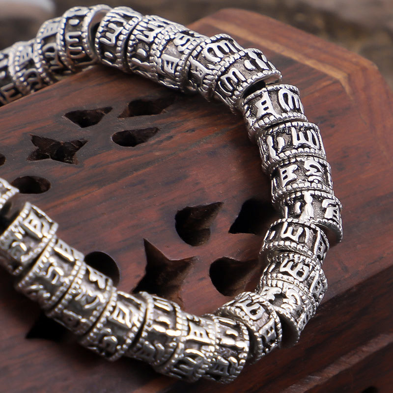 Tibetan Mantra Purity Bracelet – Silver beads on carved wooden stand with oxidized rings, artisan jewelry