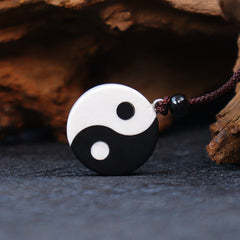 Black Obsidian White Turquoise Yin Yang Strength Fulfilment Necklace Pendant - Yin-yang pendant on burgundy cord by driftwood