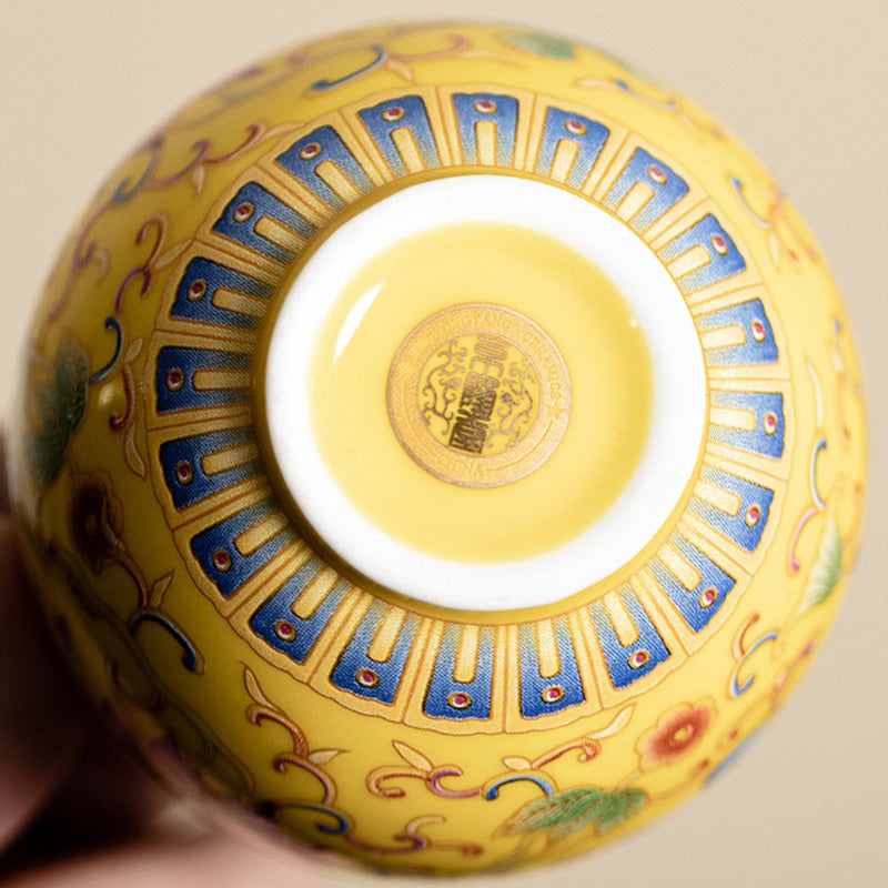 Lotus Pod Ceramic Tea Cup – inverted base view with seal mark, yellow lotus enamel