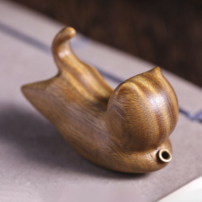 Green Sandalwood Cat Incense Burner - Rear angle on striped linen mat, meditation decor