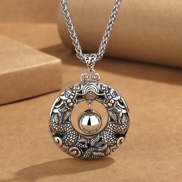 Double Dragon Bead Copper Pendant Necklace on kraft paper, antique silver finish, protective talisman