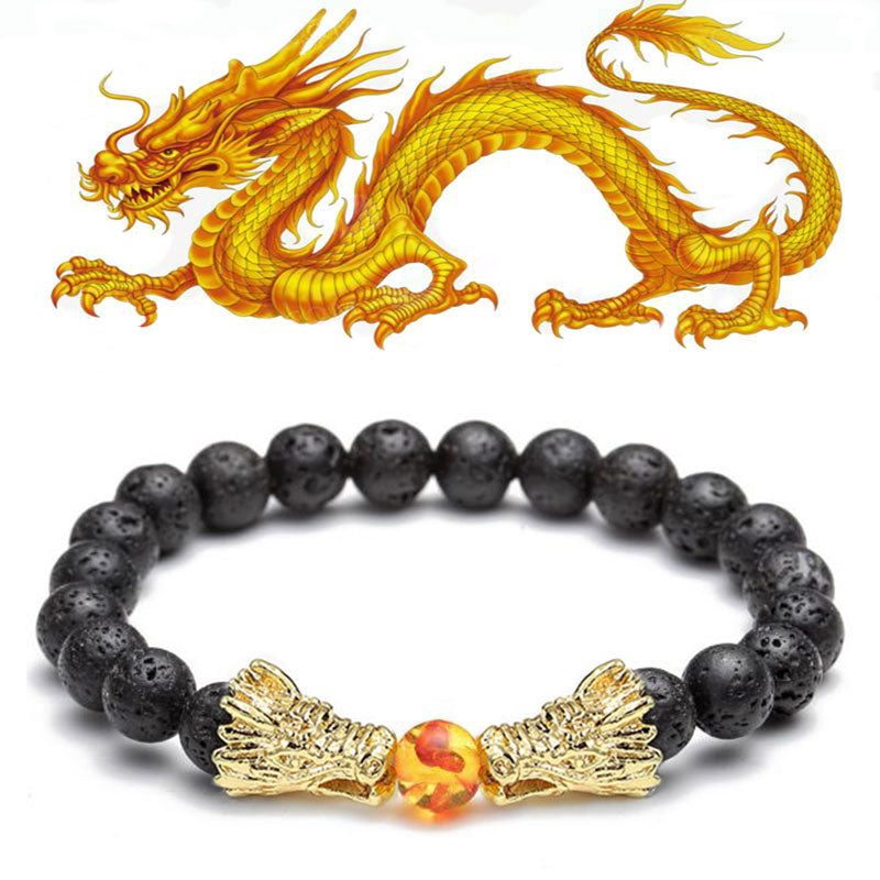 White Turquoise Lava Rock Dragon Bracelet – Black lava gold dragons amber center with foil inclusions straight-on, Powerful