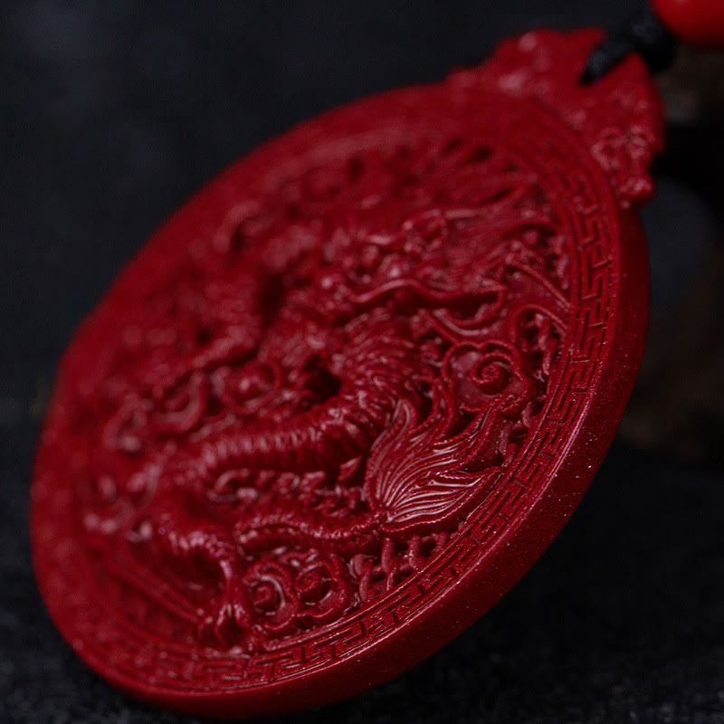 Cinnabar Dragon Pendant – Close-up dragon relief carving with meander border on deep red amulet, Auspicious