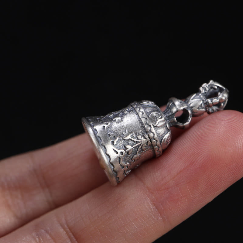 925 Silver Dorje Bell Pendant – Small ritual bell on finger showing oxidized silver finish details