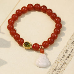 Red Agate Buddha Bracelet - On calligraphy paper with white Buddha charm detail